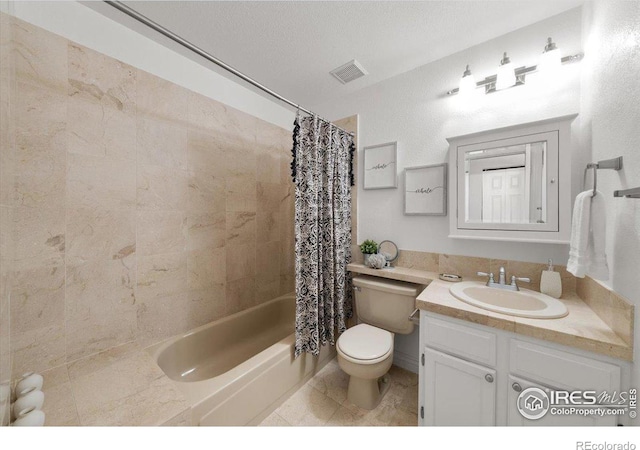 full bathroom featuring toilet, tile patterned floors, shower / tub combo with curtain, and vanity