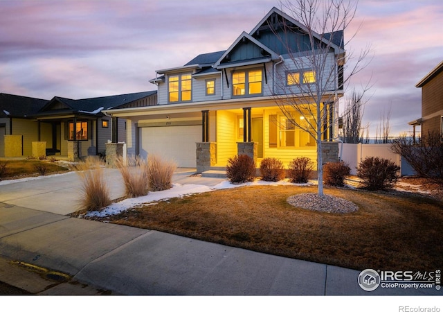 craftsman-style house featuring a garage and covered porch