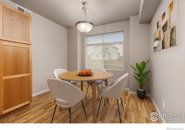 dining area with light hardwood / wood-style flooring