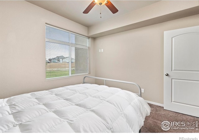 carpeted bedroom featuring ceiling fan