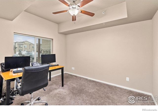 carpeted office with ceiling fan