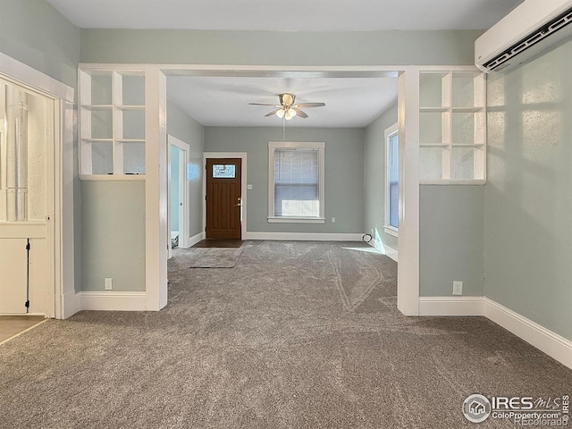 unfurnished living room featuring ceiling fan, a wall mounted air conditioner, and carpet flooring