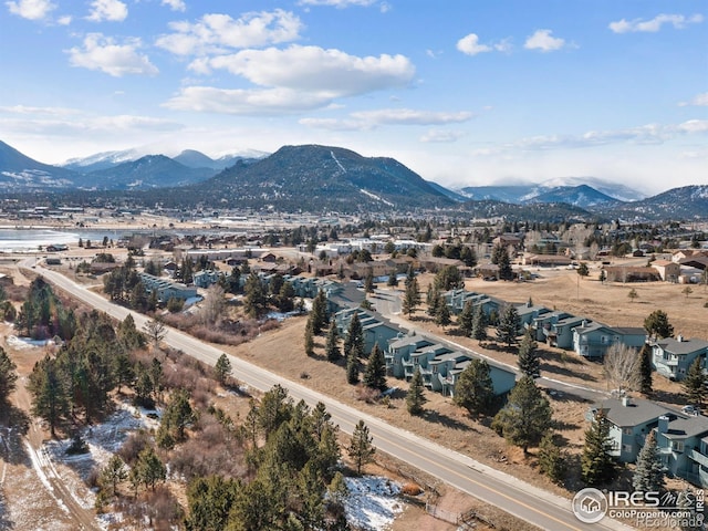 birds eye view of property featuring a mountain view