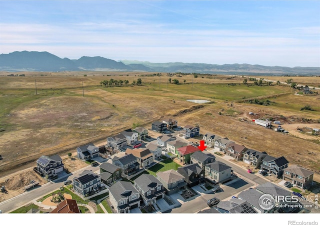 birds eye view of property featuring a mountain view