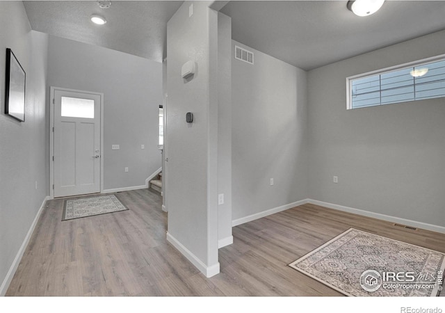 entrance foyer featuring light hardwood / wood-style floors