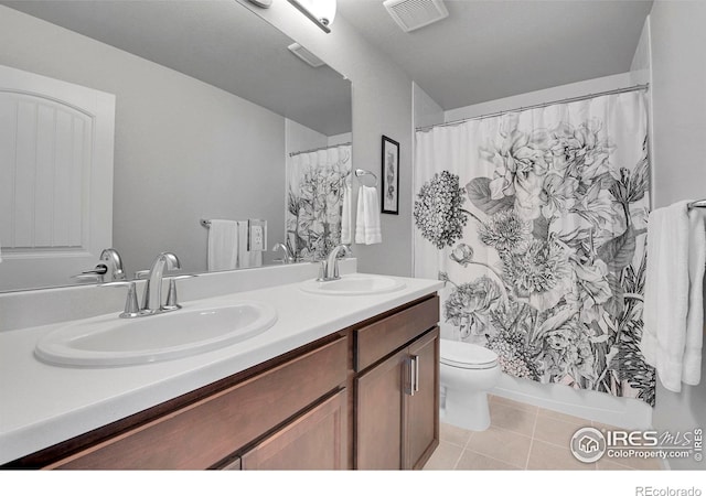 bathroom with toilet, a shower with shower curtain, vanity, and tile patterned flooring