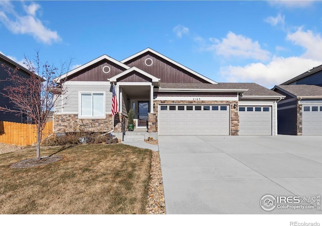 craftsman-style home with a front lawn and a garage