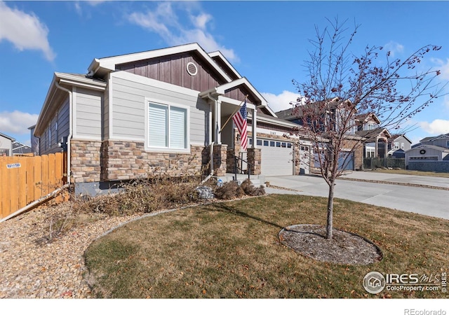 view of front facade with a front yard and a garage