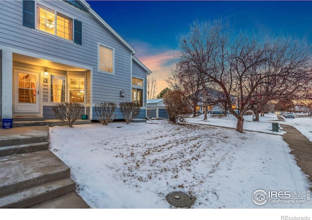 view of snow covered property