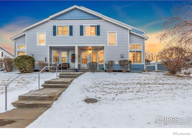 view of snow covered house