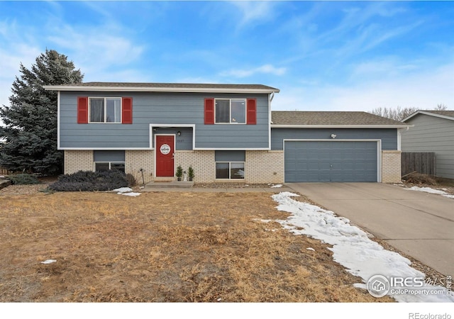 raised ranch featuring a garage