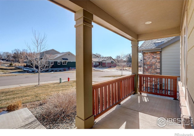 wooden terrace featuring covered porch