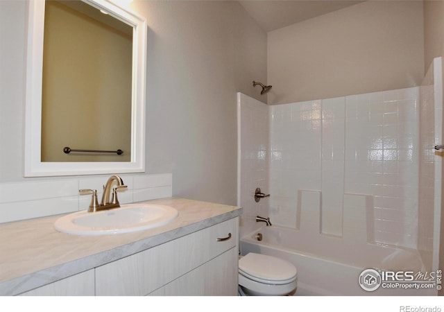 full bathroom featuring shower / bath combination, toilet, and vanity