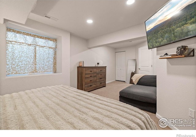 carpeted bedroom featuring a closet