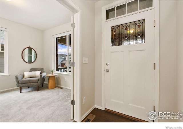 view of carpeted entrance foyer