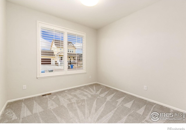 unfurnished room featuring carpet floors