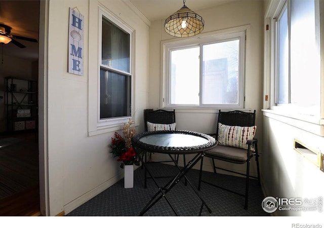 interior space featuring ceiling fan