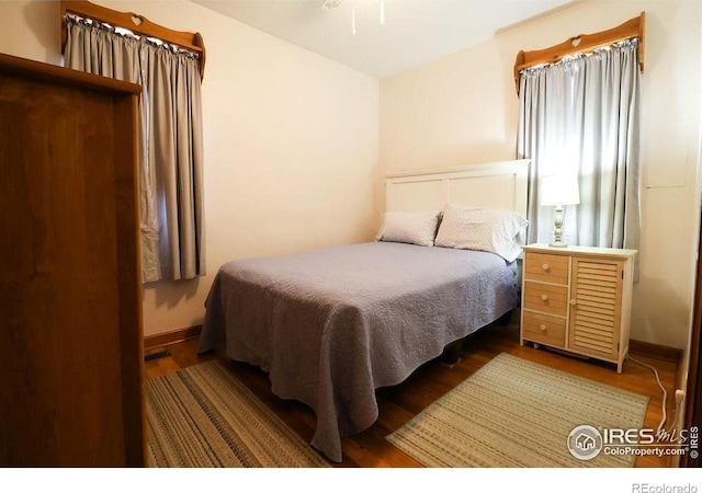 bedroom featuring wood-type flooring