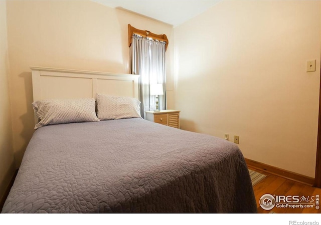 bedroom featuring hardwood / wood-style floors