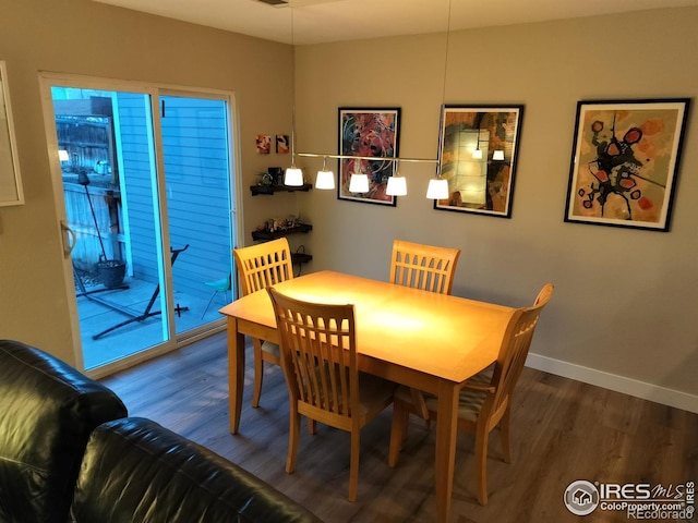 dining area with hardwood / wood-style flooring