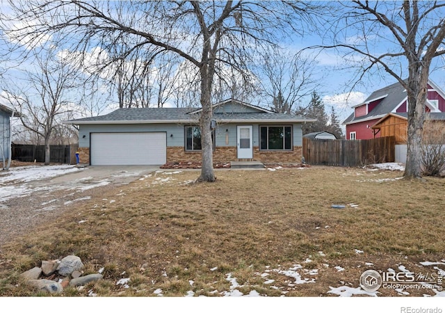 view of front of home with a lawn and a garage