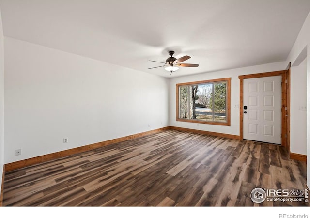 foyer with ceiling fan and dark wood-type flooring