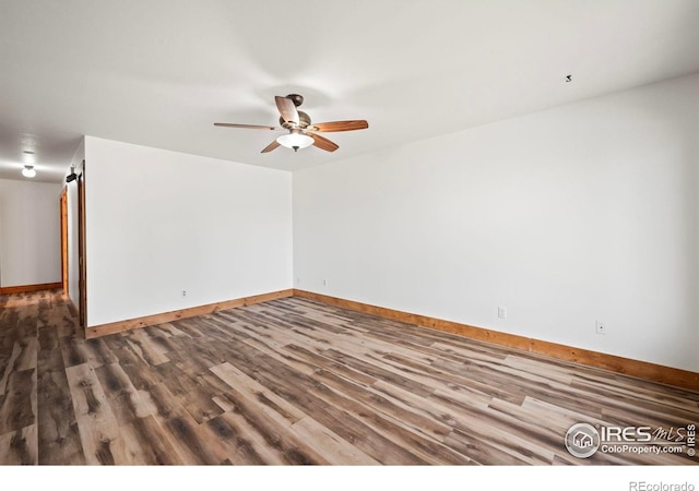 unfurnished room with ceiling fan and hardwood / wood-style floors