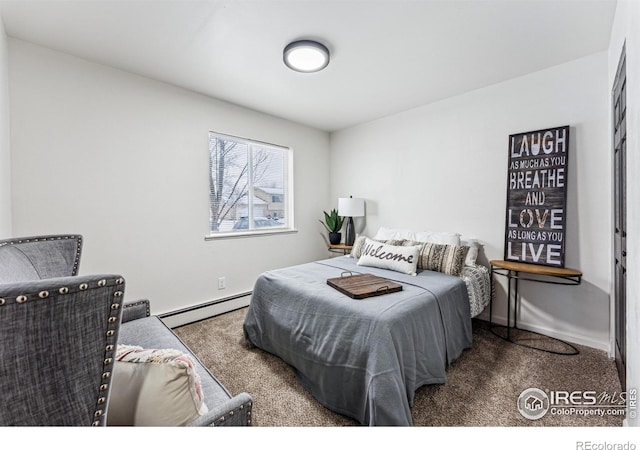 carpeted bedroom with baseboard heating