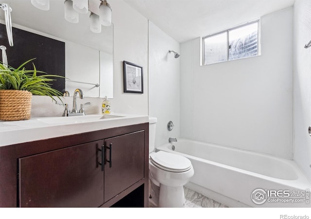 full bathroom featuring toilet, vanity, and washtub / shower combination