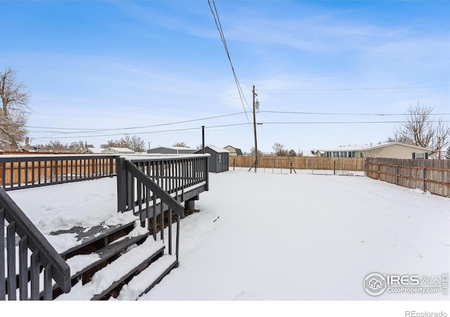 view of snow covered deck