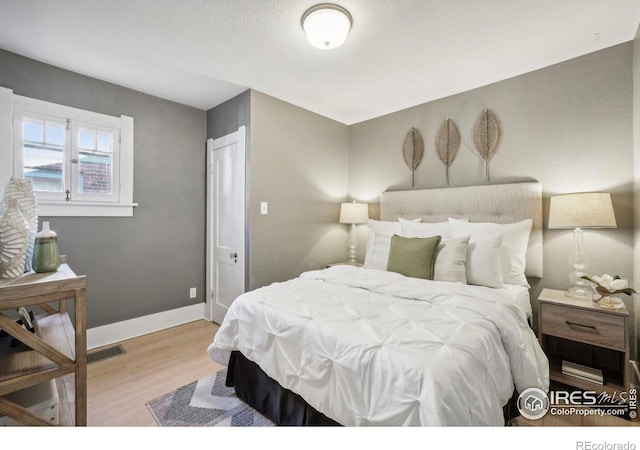 bedroom featuring light hardwood / wood-style flooring