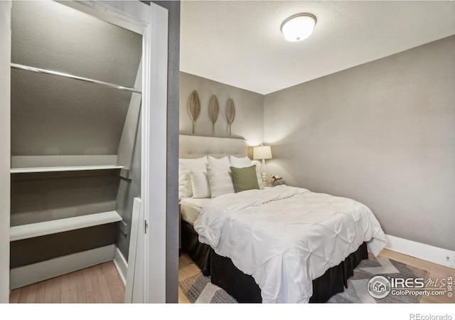 bedroom featuring light wood-type flooring