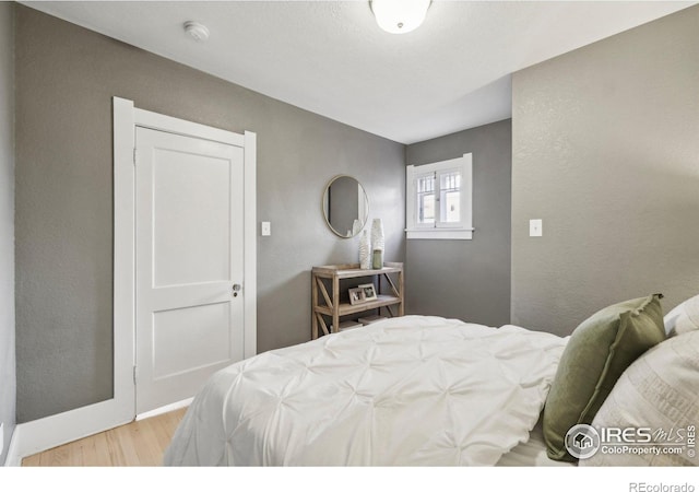 bedroom with light wood-type flooring