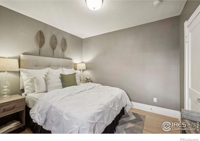 bedroom featuring hardwood / wood-style flooring