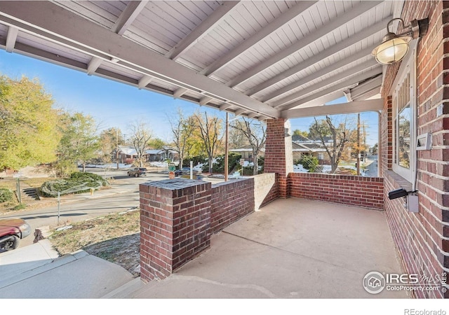 view of patio featuring a porch