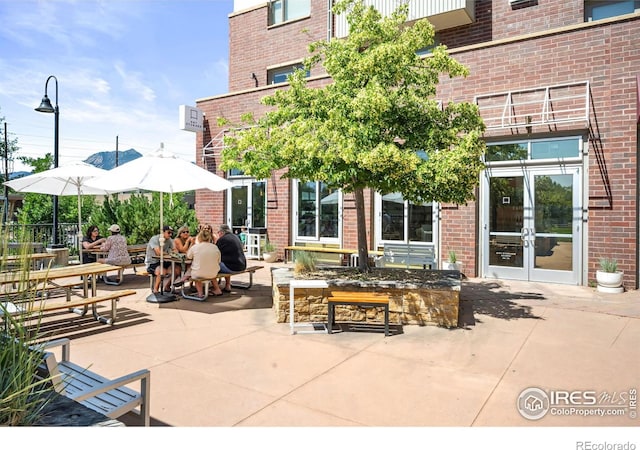 view of patio featuring french doors