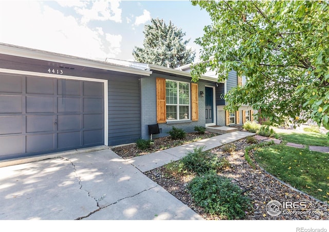 ranch-style home featuring a garage