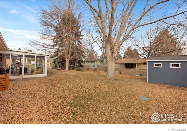 view of yard featuring a sunroom