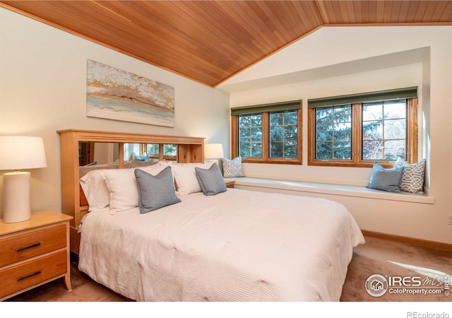 bedroom with wood ceiling, vaulted ceiling, and carpet flooring