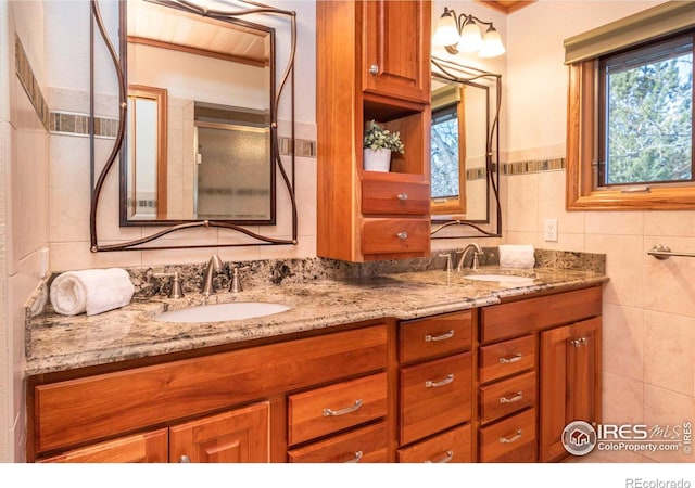 bathroom with tile walls and vanity