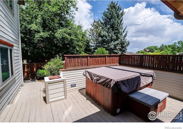 deck featuring a hot tub