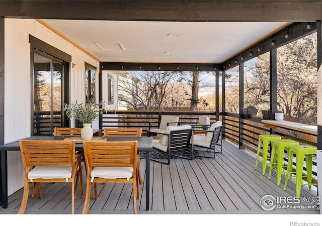 wooden deck with outdoor dining space