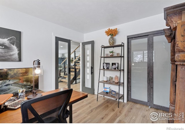 office space with light hardwood / wood-style flooring