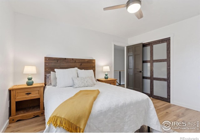 bedroom featuring ceiling fan and light wood-type flooring