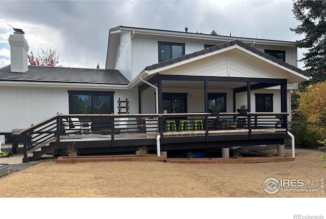 rear view of property with a deck