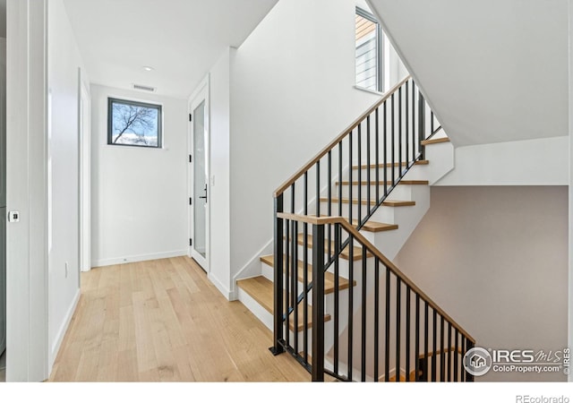 staircase featuring hardwood / wood-style flooring