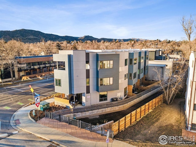 view of building exterior with a mountain view