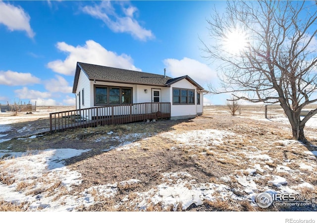 view of front of home featuring a wooden deck