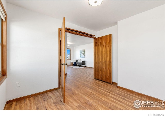 spare room featuring light wood-type flooring