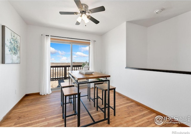 dining room with light wood-type flooring and ceiling fan